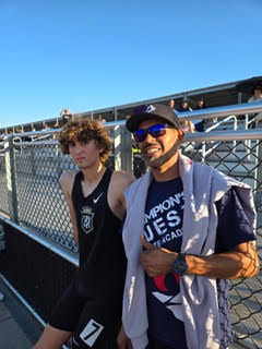 Joseph Janji with Champion’s QUEST coach at a Servite track meet